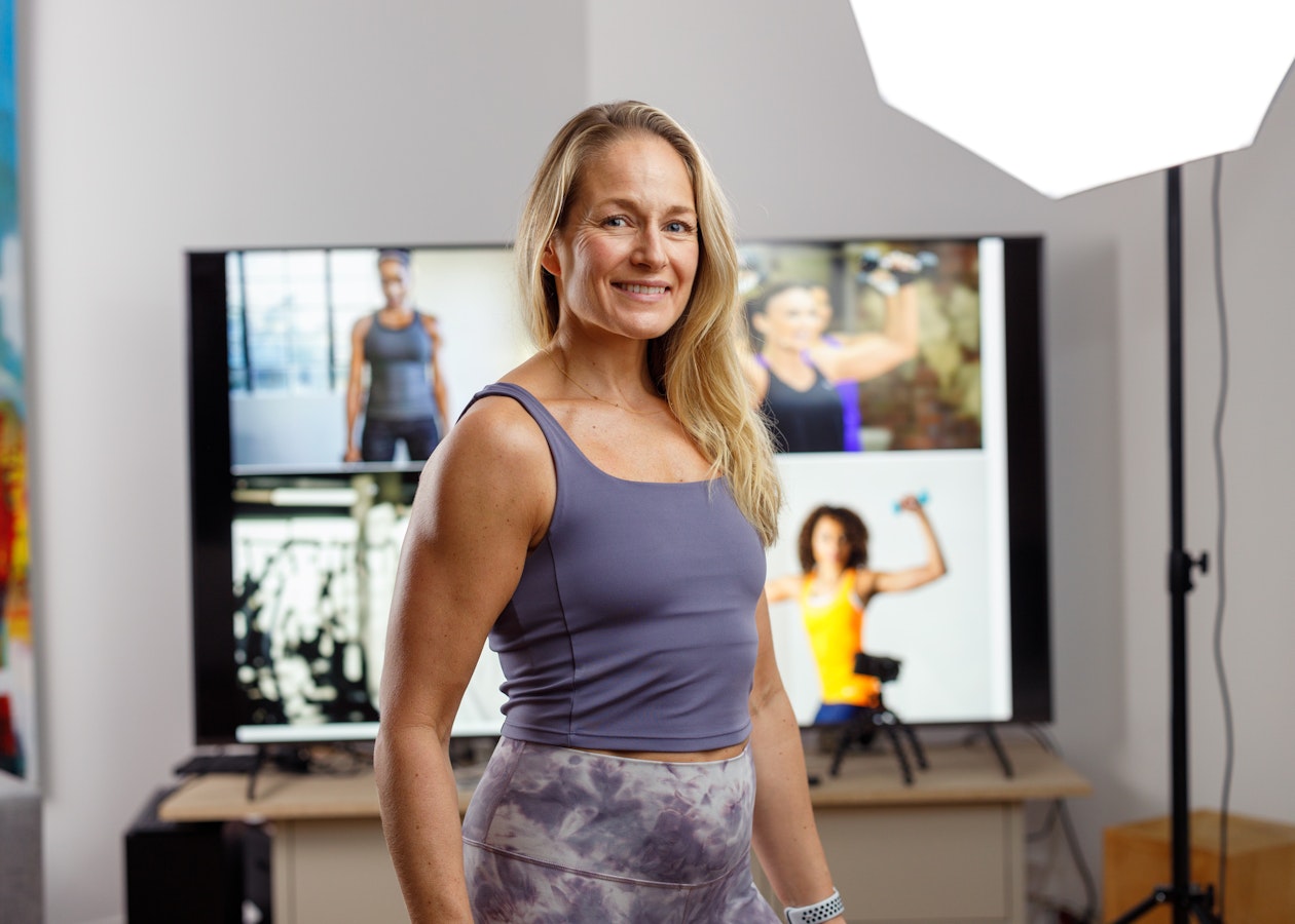Professional fitness instructor demonstrating the LiveSwitch platform capabilities